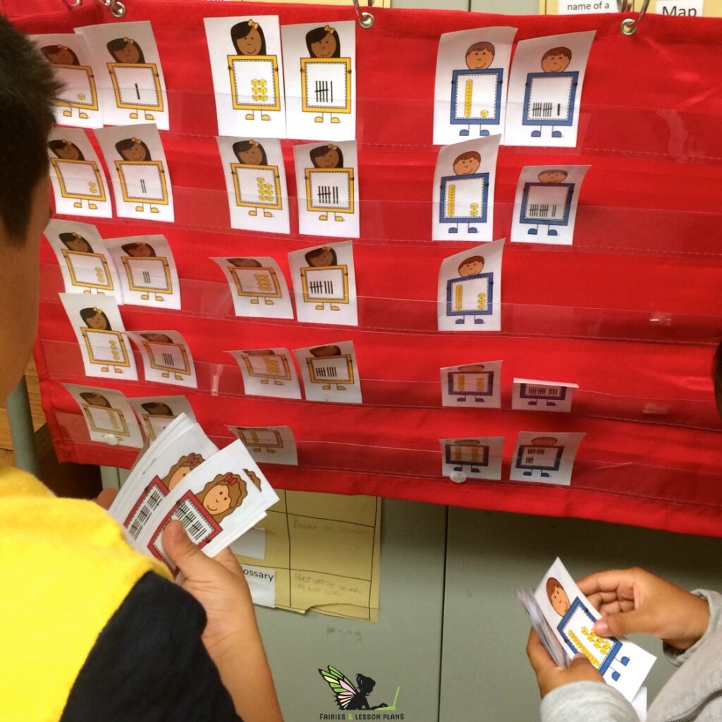 Pocket chart with Base Ten Block flashcards and Tally Mark flashcards placed side-by-side to the numbers they match.